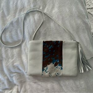 Col de Mar leather cowhide crossbody bag with turquoise patches.